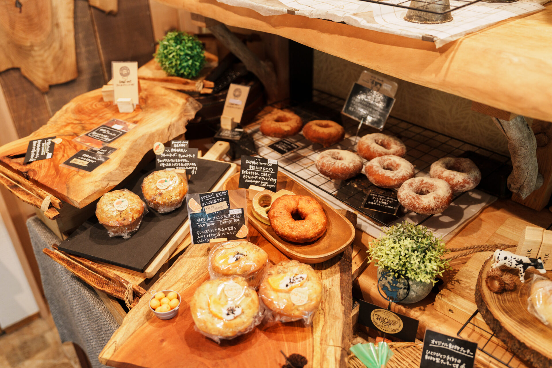 Gluten-free baked goods and sweets on a wooden display at the café in Hakuba