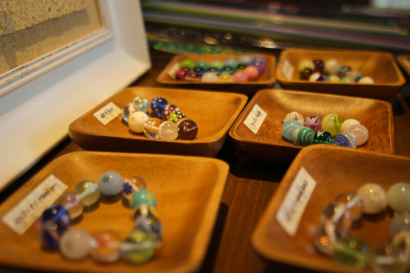 Close-up of different types of glass beads available for making and customisation at Kira Kira Glass.