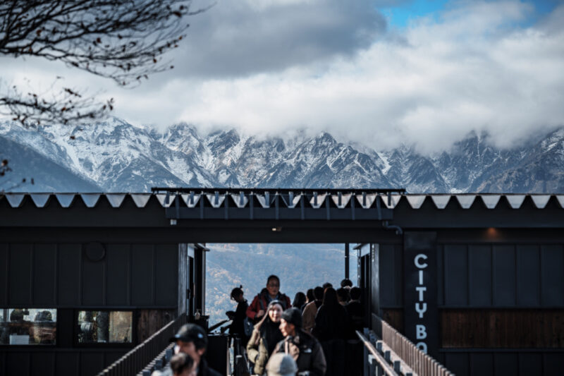 Girl looking out to Hakuba Valley from the outdoor terrace of CHAVATY HAKUBA.