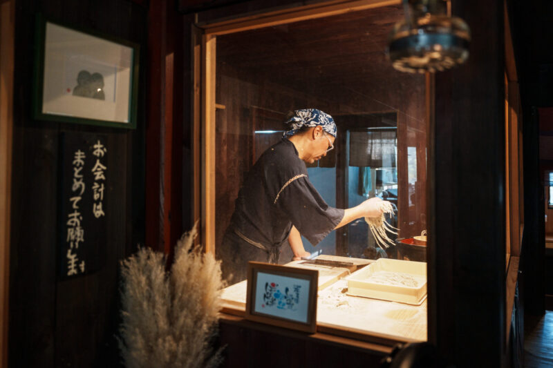 DSC07788 Girl looking out to Hakuba Valley from the outdoor terrace of CHAVATY HAKUBA.